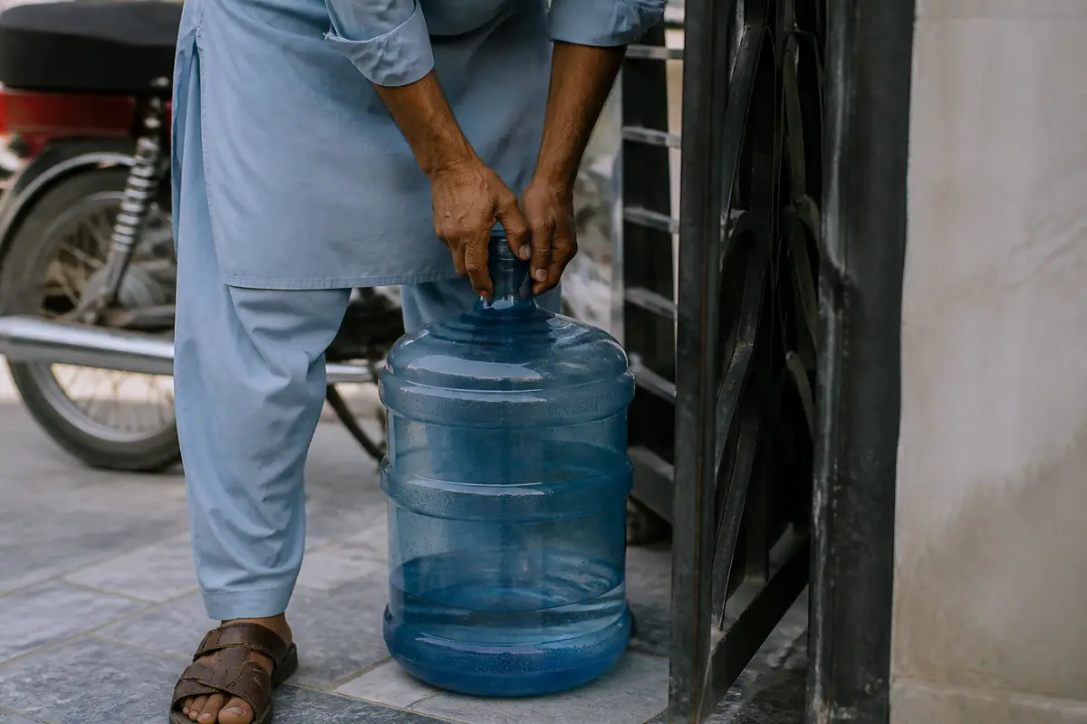 Full bottles being carried to a customer door