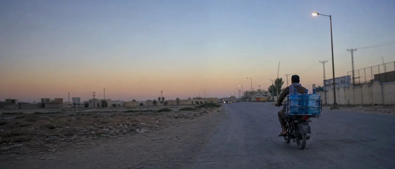 Rider on a motorcycle at dusk on a route with weak coverage